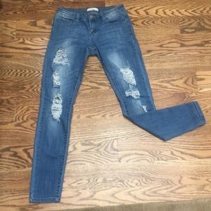 low rise medium wash distressed skinny jeans